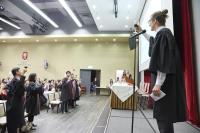 The MC leading a German-style toast to the graduating class of 2019